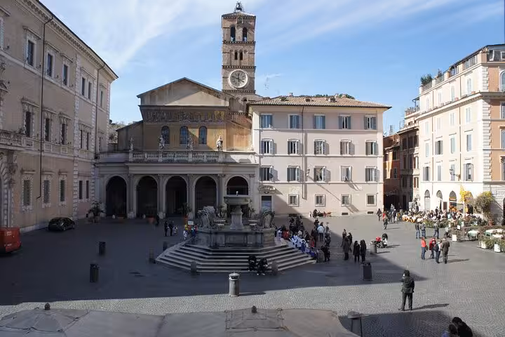 Charming Italian piazza with historic basilica, perfect for cultural exploration on an enogastronomy tour.