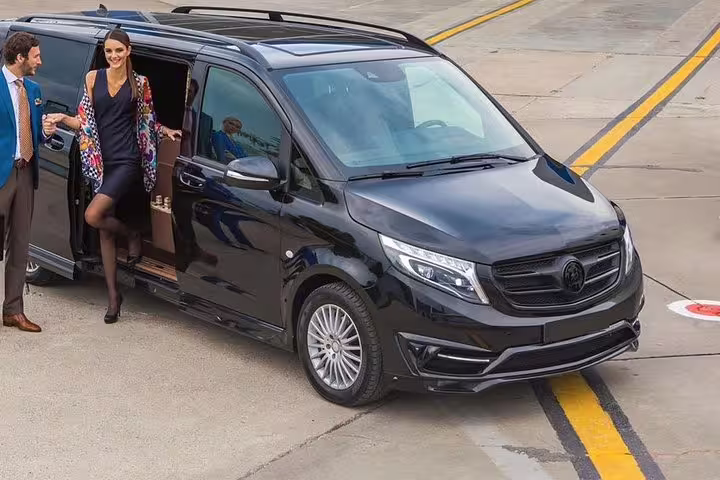 Private Izmir Airport to Izmir center hotel transfer, luxury black van pickup at terminal curbside