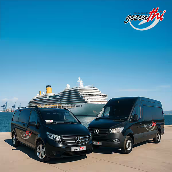 Two black Gezenthi Mercedes vans parked on a port next to a large white cruise ship under a clear blue sky.