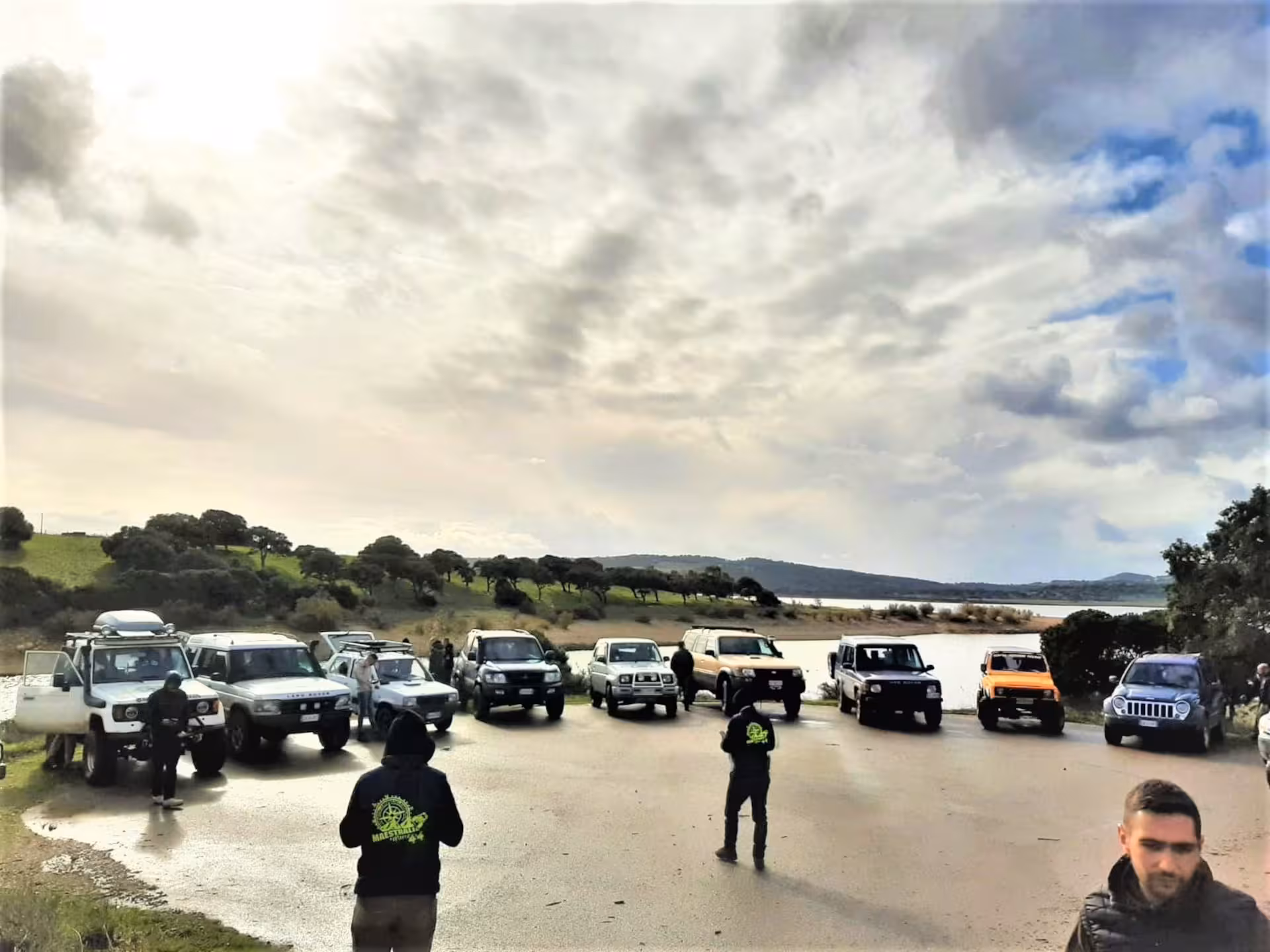 Jeep convoy ready for adventure on Mount Limbara tour starting from Tempio, under a dynamic cloudy sky.