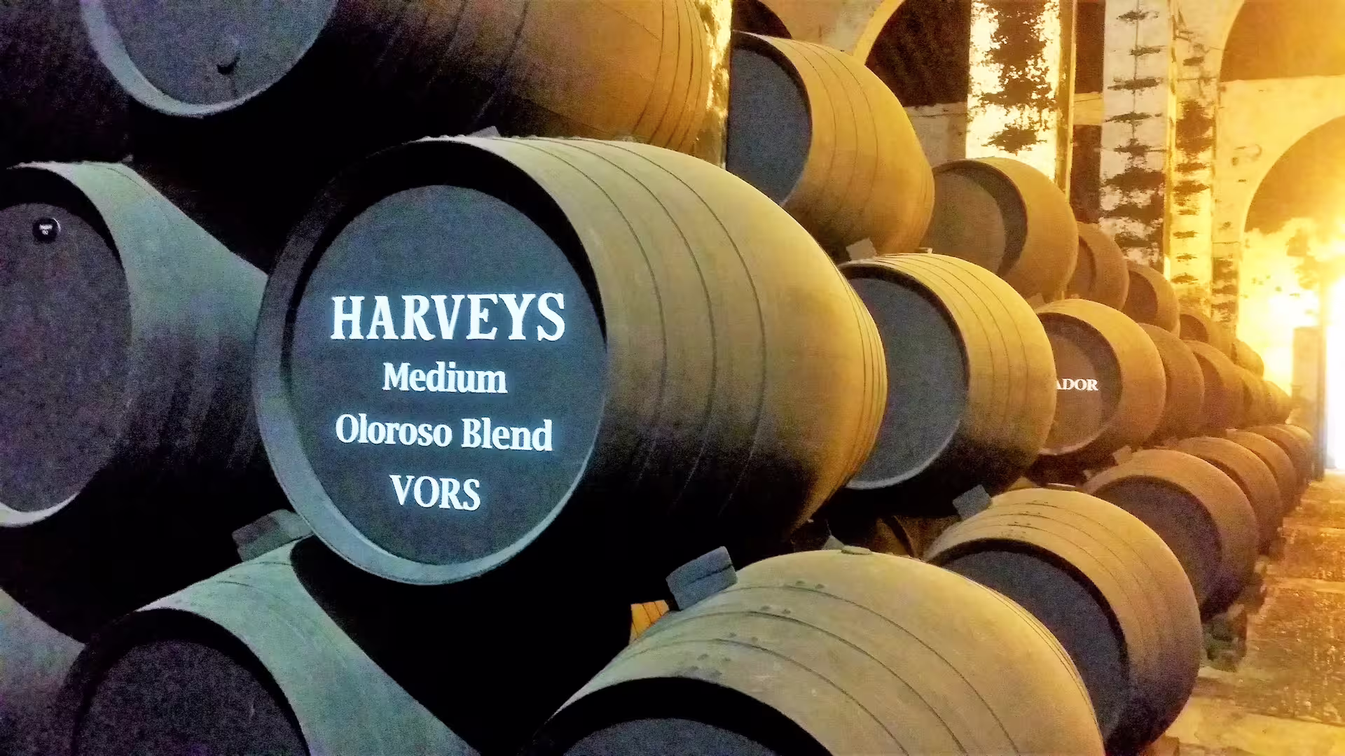 Sherry wine barrels in a Jerez bodega, tasting stop on private day trip with hotel pick-up from western Costa del Sol
