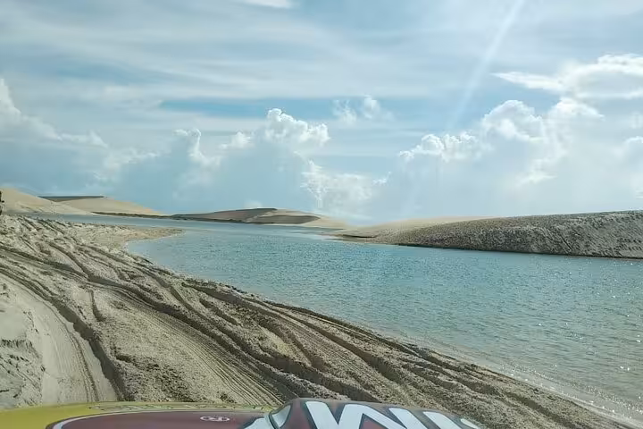 4x4 dune ride along a lagoon in Jericoacoara National Park, Brazil, on a full-day tour