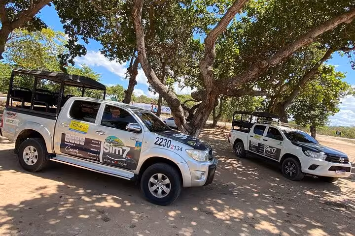 4x4 pickup transfer vehicles in Jericoacoara, Ceará, ready for shared ride to Fortaleza airport