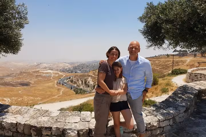 Family at Jerusalem viewpoint on a private day trip from Tel Aviv, overlooking the Judean Desert landscape
