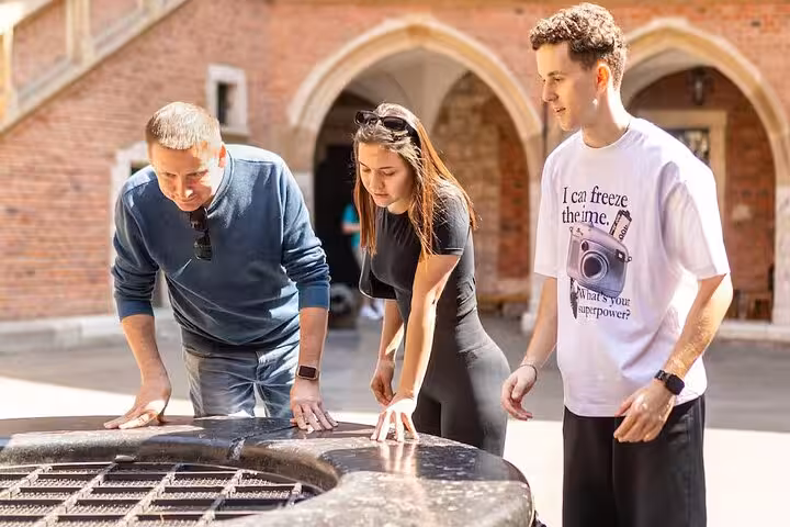 Visitors explore historical architecture on a guided tour in the Jewish Ghetto during the World War II walking tour.