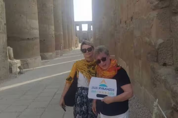 Travelers at Karnak Temple corridor on Luxor private day trip from Safaga Port with expert guide