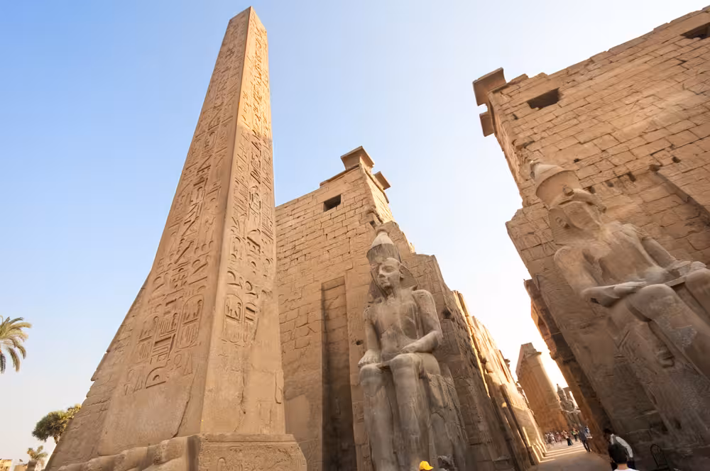 Karnak Temple obelisk and colossal statues in Luxor, highlight of Egypt Golden Triangle 11-day 5-star tour