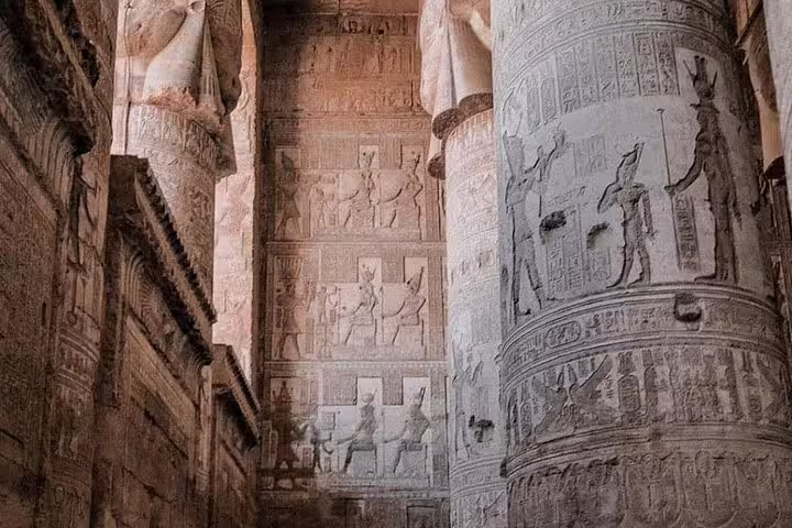 Karnak Temple columns with ancient hieroglyphs on Luxor overnight tour from Cairo by flight, Egypt