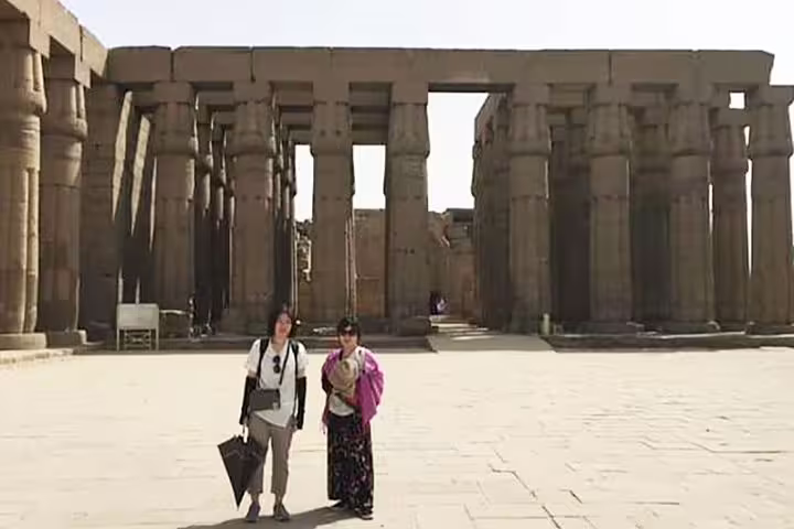 Tourists in the Karnak Temple courtyard during a 3-day Luxor city break with private guide, hotel and meals
