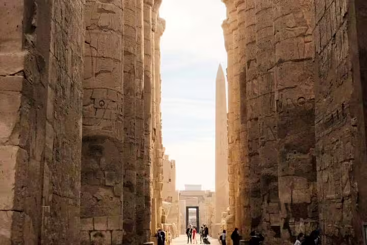Karnak Temple avenue with towering pylons and Luxor Obelisk, highlight on 3 nights 2 days Cairo sleeper train tour