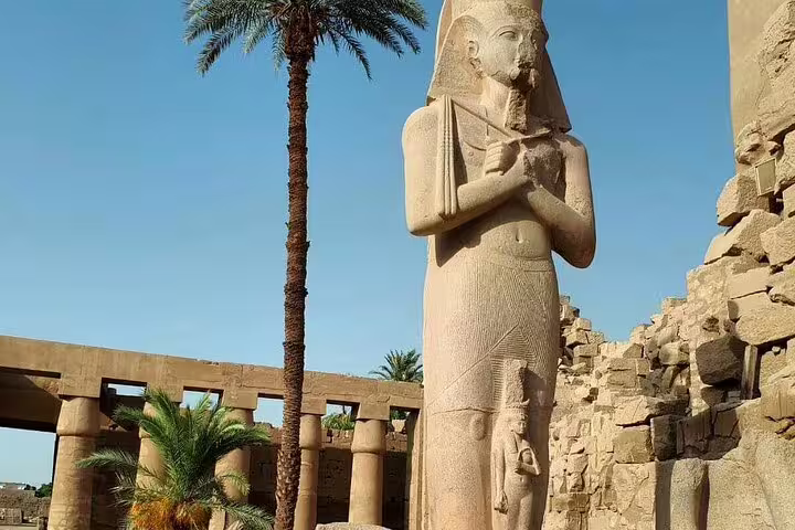 Colossal pharaoh statue at Karnak Temple, Luxor on private overnight tour from Cairo by flight