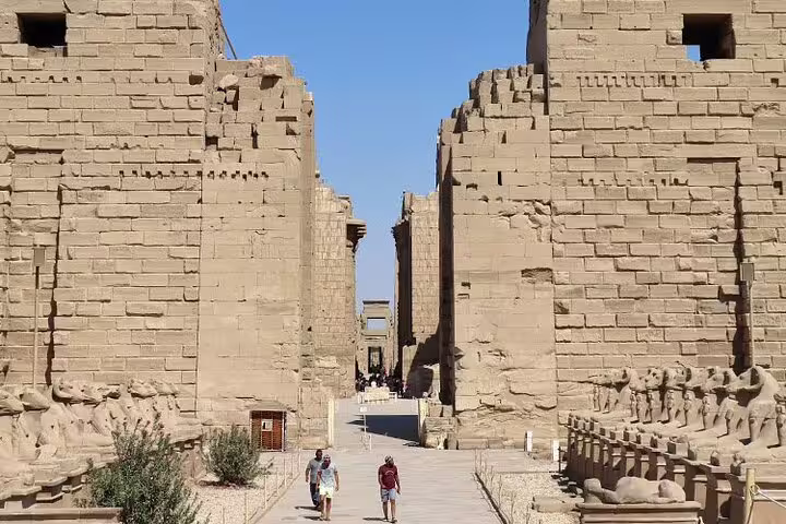 Walkway between massive Karnak Temple pylons in Luxor, visited on historical day tour by bus from Hurghada
