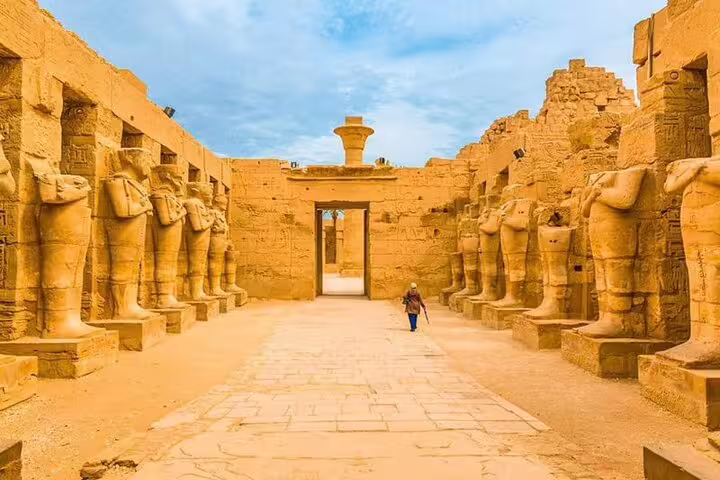 Karnak Temple avenue of ram-headed sphinx statues on Luxor historical day tour by bus from Hurghada