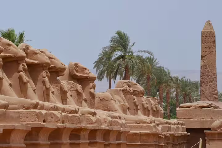 Sphinx statues and obelisk at Karnak Temple complex, Luxor on day trip by plane from Sharm El Sheikh