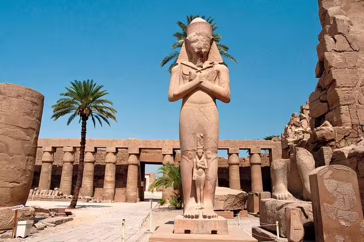 Karnak Temple statue courtyard on Luxor Valley of the Kings day tour by bus from Hurghada, Egypt
