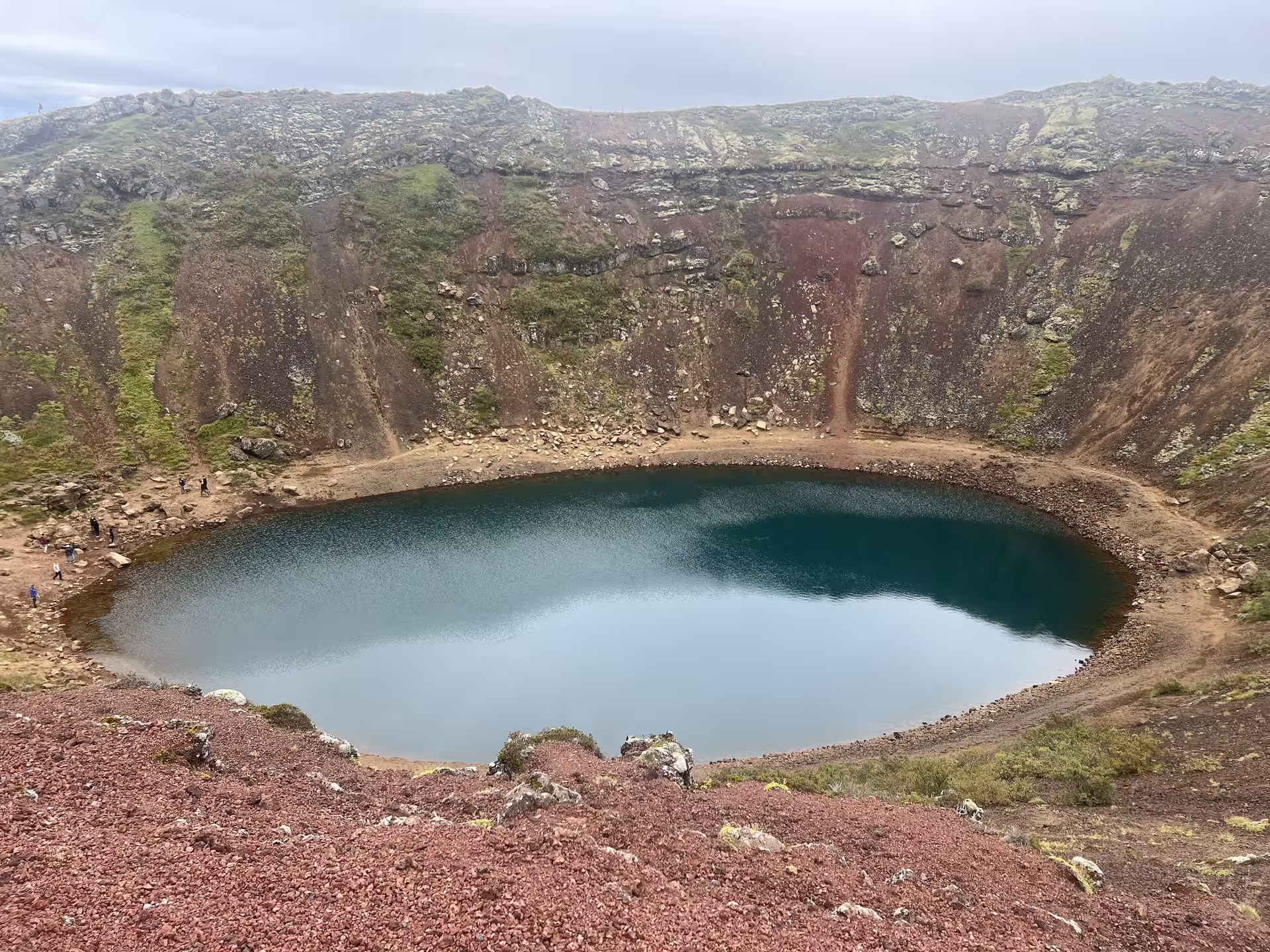 Kerið crater lake with red volcanic slopes, a highlight stop on Golden Circle Discovery day tour from Reykjavik