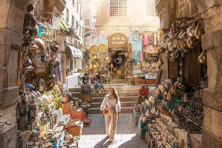 Khan el-Khalili bazaar alley with brass lanterns and souvenirs, Cairo tour from Alexandria returning to Port Said