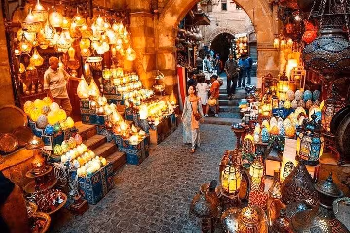 Khan El Khalili bazaar alley glowing with lanterns and crafts on a Cairo Citadel and museum tour