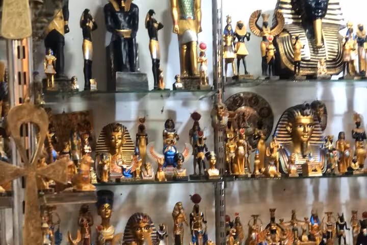 Khan El Khalili bazaar shop display of pharaoh and Anubis souvenirs on private Cairo tour with lunch