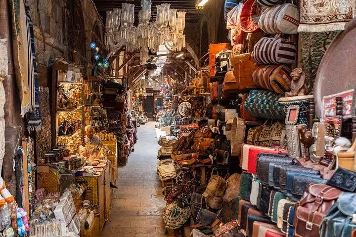 Khan El Khalili bazaar alley with textiles, lanterns and crafts on private Cairo Citadel and museum tour