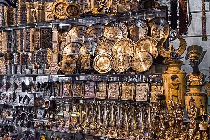 Brass plates and Egyptian souvenirs at Khan el Khalili on a private Cairo market tour with local dish