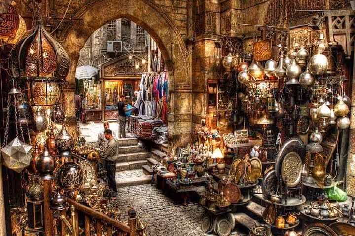 Historic Khan el Khalili Market in Cairo with ornate lamps and spices, part of a private tour and local dish