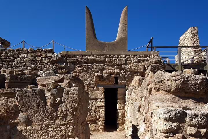 Stone ruins and restored horned altar at Knossos Palace on a skip-the-line private half-day Heraklion tour