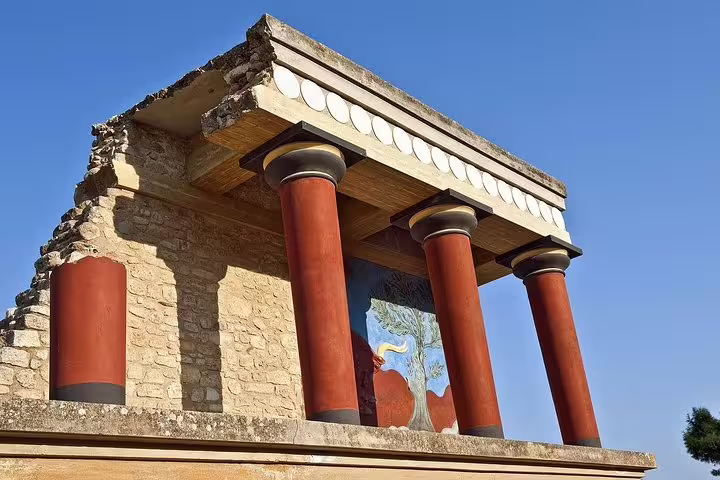 Red columns and restored facade at Knossos Palace in Crete, visited on a private full-day tour from Heraklion