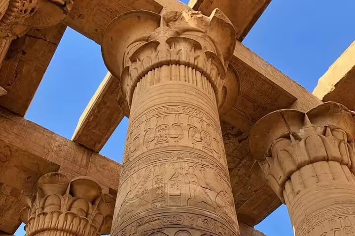Close-up of carved columns and hieroglyphs inside Kom Ombo Temple, Egypt, on Luxor guided day trip