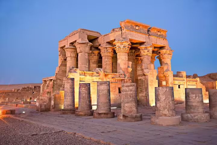 Kom Ombo Temple illuminated at dusk with carved columns, a highlight of Luxor to Edfu and Kom Ombo tour