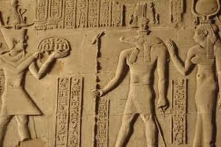 Ancient hieroglyphic relief at Kom Ombo Temple, key stop on overnight Luxor tour from Aswan Nile cruise