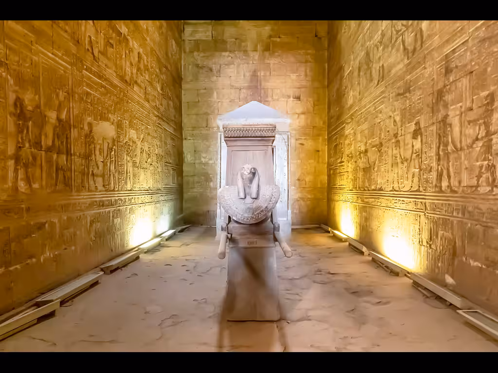 Inside Kom Ombo Temple with carved hieroglyphs and statue, Aswan stop on budget Egypt itinerary