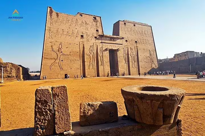 Kom Ombo Temple exterior with ancient carvings under blue sky, key stop on Luxor to Abu Simbel tour