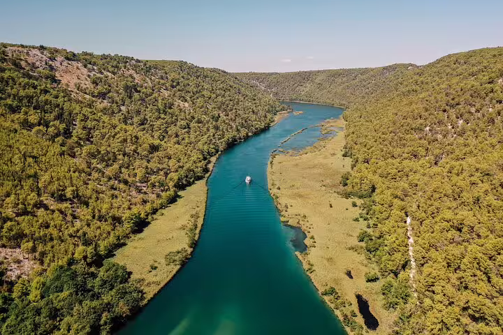 Aerial view of Krka River canyon with boat cruise route through Krka National Park, Croatia