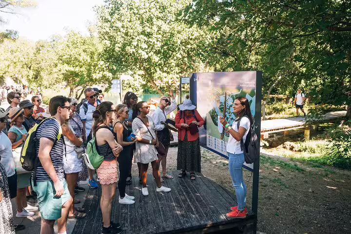 Guide briefing group at Krka National Park entrance before boat cruise and swimming at waterfalls