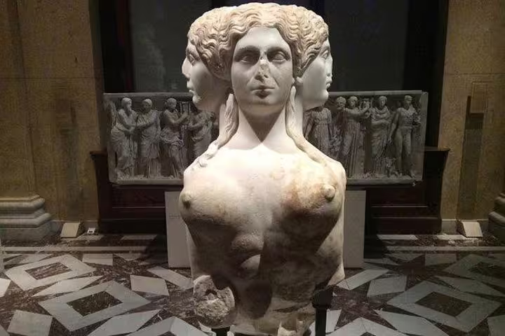 Admire the intricate three-headed bust sculpture at Kunsthistorisches Museum on a private tour with tickets included.