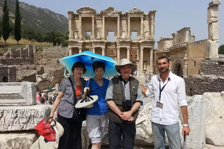 Kusadasi private Ephesus shore tour with local guide and travelers in front of the Library of Celsus