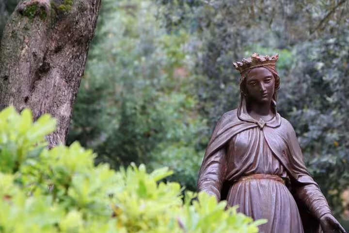 Virgin Mary House statue in green gardens, a serene stop on Kusadasi to Ephesus private tour