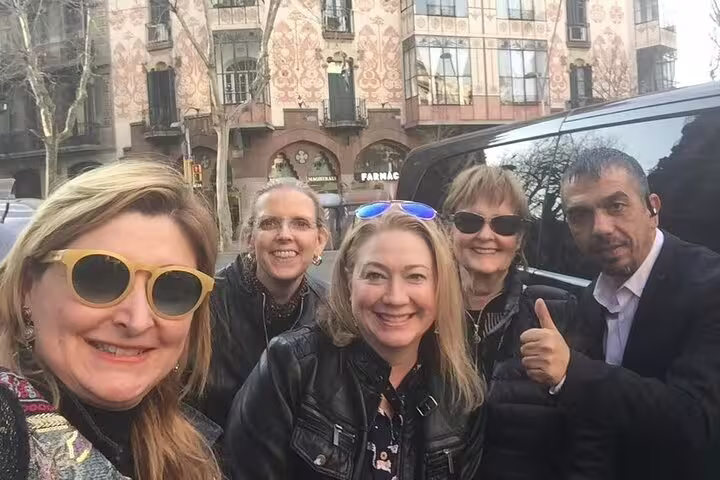 Group enjoying a memorable day at La Roca Village with historic architecture in the background.