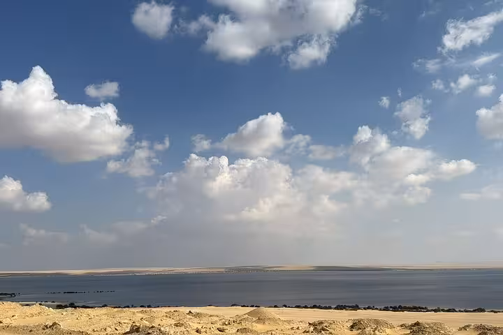 Wide view of Lake Qarun under dramatic clouds, Fayoum Oasis private full-day tour from Cairo, Egypt