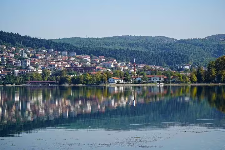 Lake Sapanca shoreline with hillside town reflections, scenic stop on private day trip from Istanbul