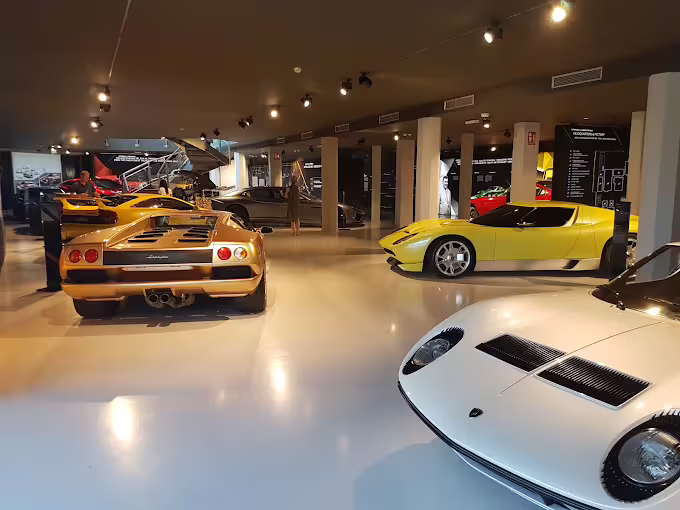 Inside Lamborghini Museum near Bologna with classic supercars on showroom floor, combo entry ticket experience