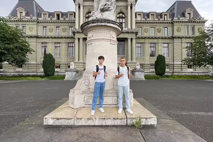 Travelers outside Palais de Rumine in Lausanne, a city center scavenger hunt self-guided walking tour stop