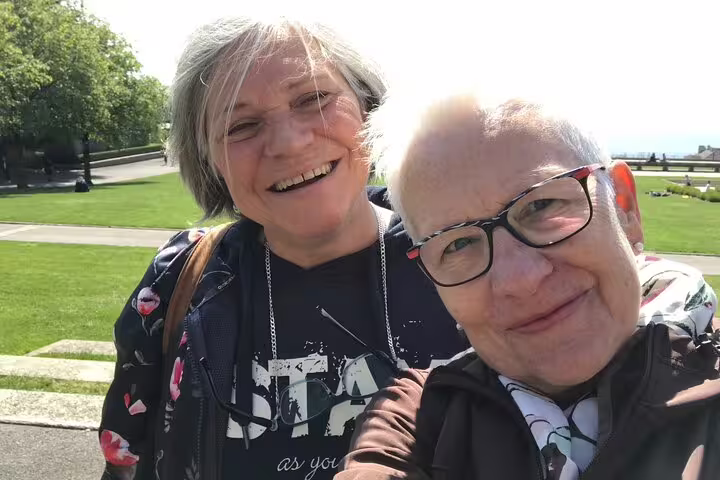 Smiling travelers selfie in Lausanne city center park during a self-guided scavenger hunt walking tour