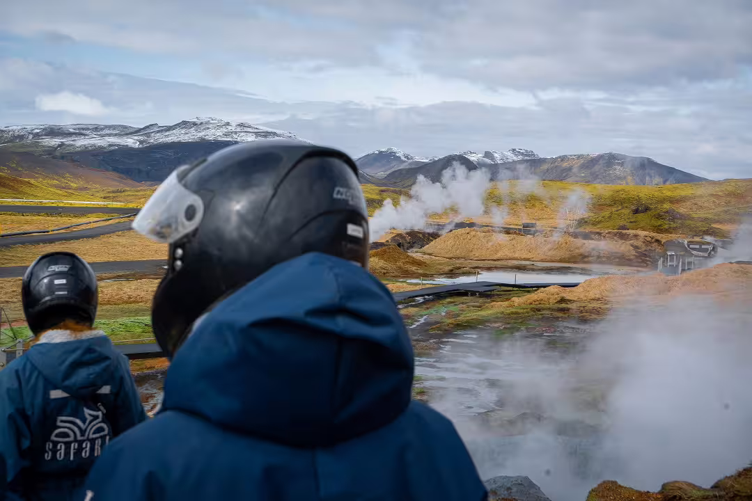 Adventurers in helmets explore steaming geothermal landscapes on a thrilling 2-hour lava field buggy tour.