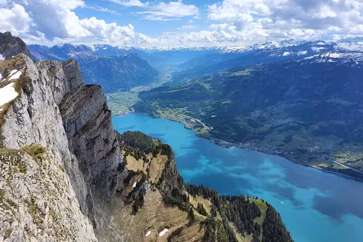 Dramatic cliffs on Leistkamm Ridge overlooking Walensee, Zurich guided hiking day trip with Swiss Alps views