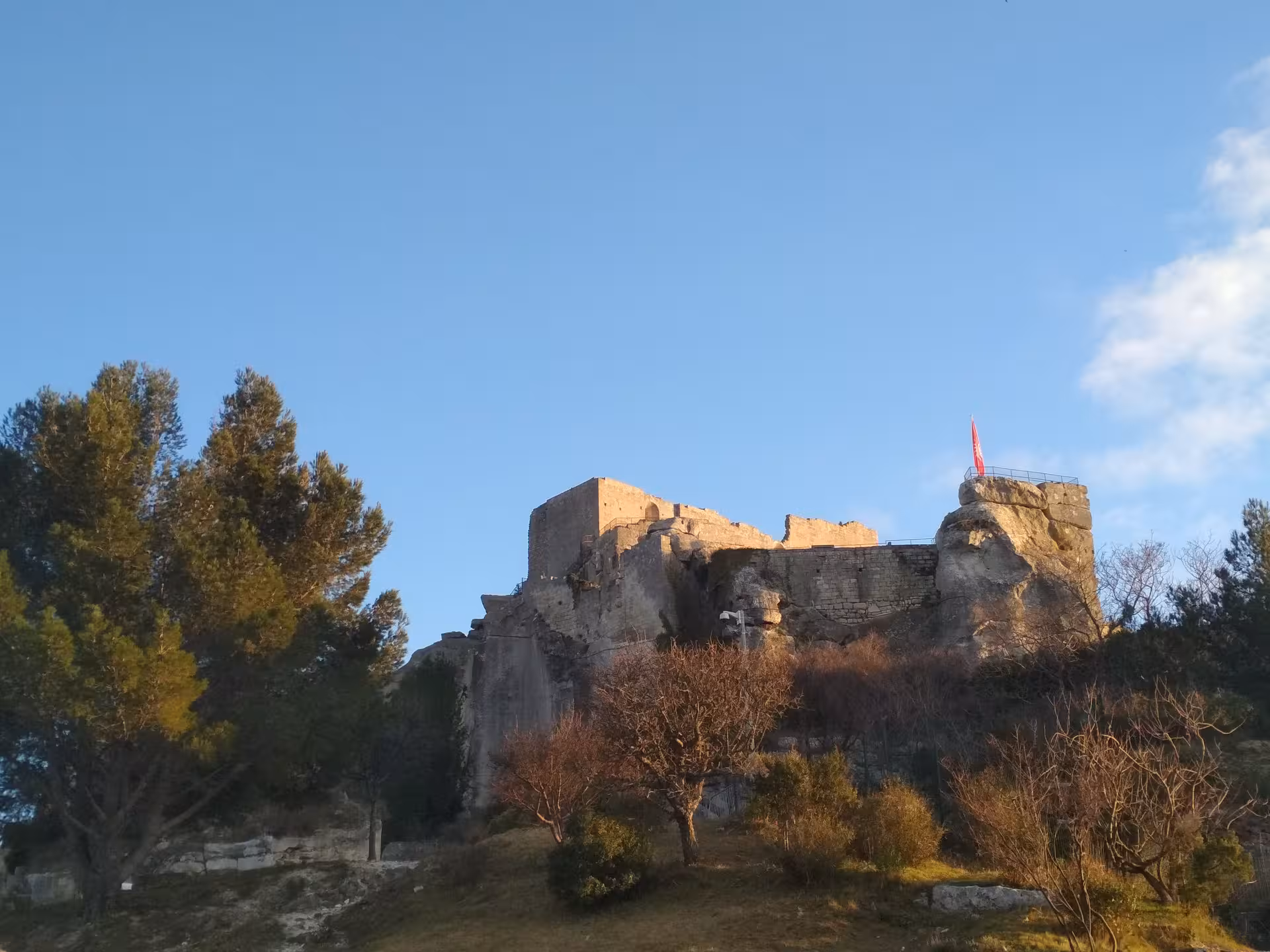 Les Baux-de-Provence castle ruins at golden hour, a highlight of Arles and Provence lifestyle tour