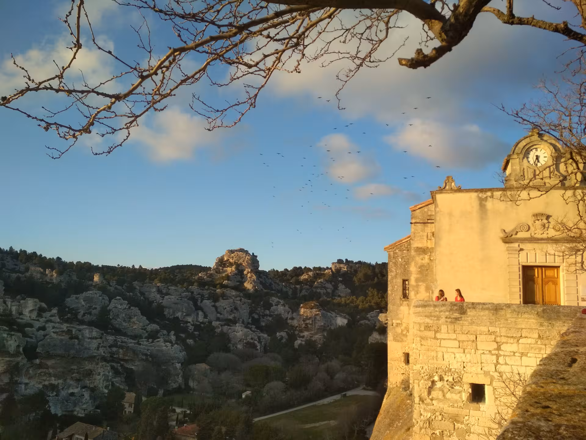 Les Baux-de-Provence stone ramparts at sunset overlooking Alpilles cliffs on Arles day tour in Provence