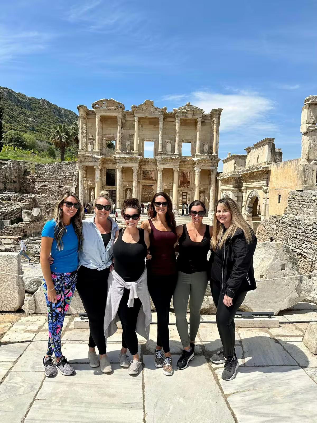 Group photo at the Library of Celsus in Ephesus on a private panoramic Ephesus tour from Kusadasi