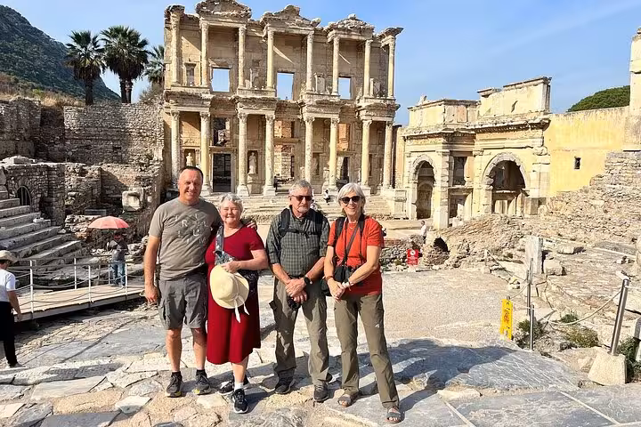 Visitors in front of the Library of Celsus ruins in Ephesus, part of the Bodrum Ephesus and House of Mary day trip